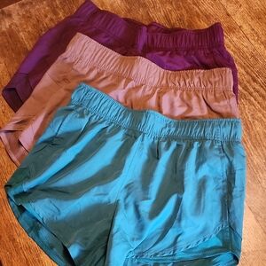 Set of Three Athletic Shorts in Purple, Tan, and Teal
